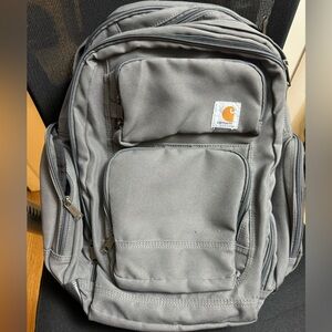 Grey Carhartt backpack. Barely used. Many many pockets, can be used as a daily.